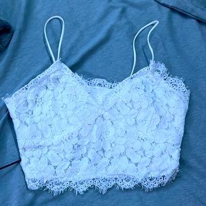 a small white meshy crop top